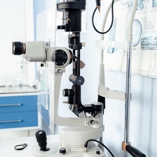 Close-up of a slit lamp biomicroscope in an eye care clinic.
