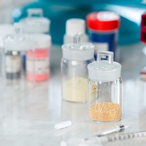 Detailed close-up of laboratory flasks and equipment, showcasing chemistry materials in a lab setting.